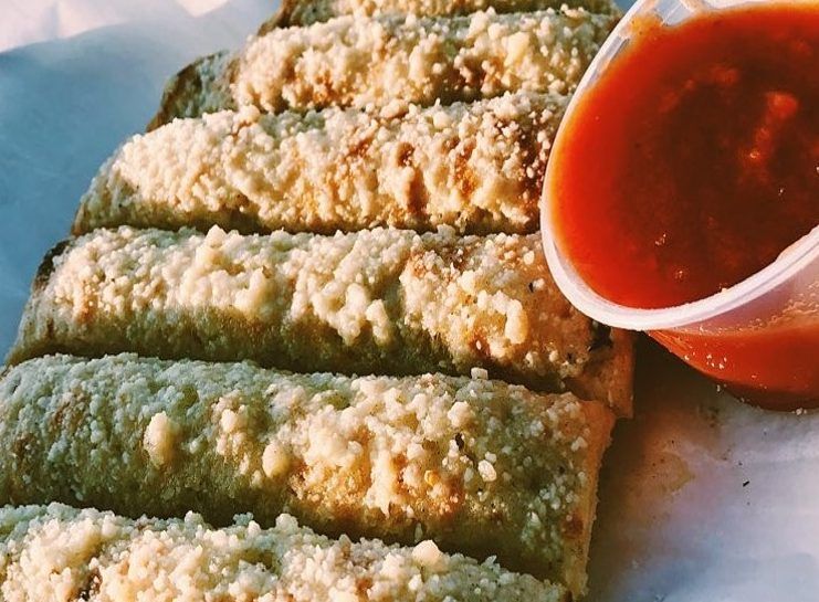 Mozzarella sticks with red dipping sauce