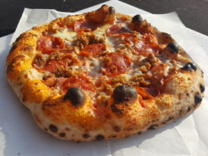 Small slices of tomato and cheese pizza