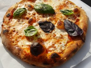 Margherita small pizza with basil on top